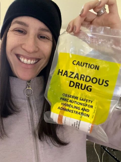 Abby holding her first mail order of oral chemo.